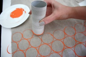 Cardboard tubes are one of the most useful things ever.  I bet it would be fun to squish them and make different shapes to print as well. Click for source.