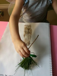 Kid using a pine twig brush, photo from Rockabye Butterfly, click for link