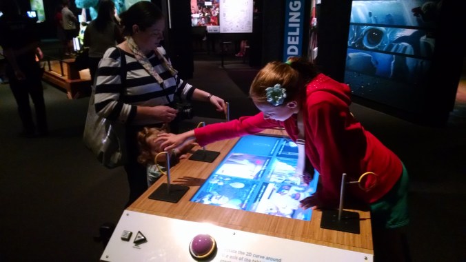 This was one of the interactives where I thought the handles for controlling the interactive were more interesting than the activity itself. Each handle was the same shape as the line on the screen which one rotated to make a 3D shape. Very clever!